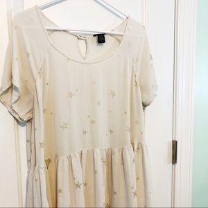 cream-colored, star printed babydoll-style top